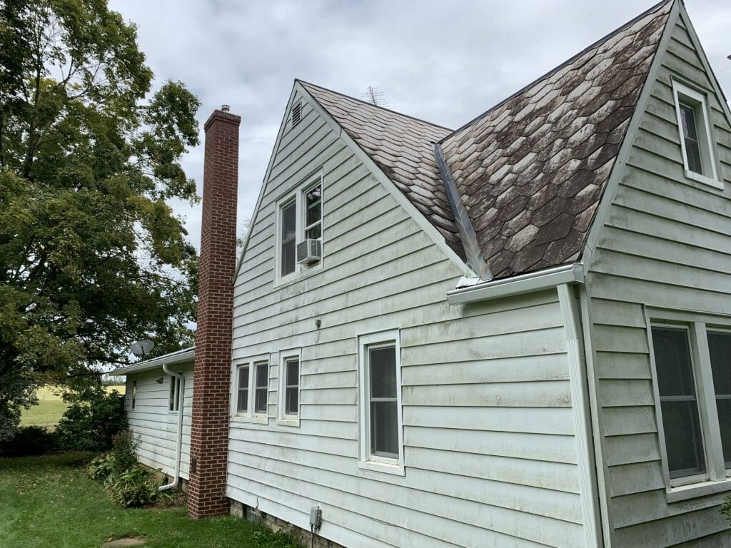 The same stone and siding after K-Guard was installed