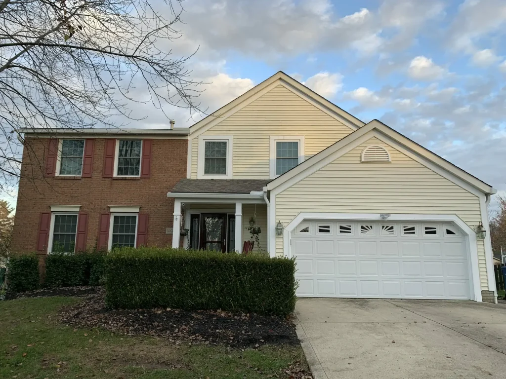 Brick and siding home with K-Guard gutters and garage