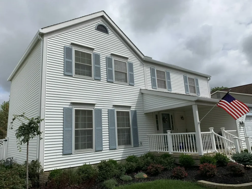 White home with a front porch and K-Guard gutters
