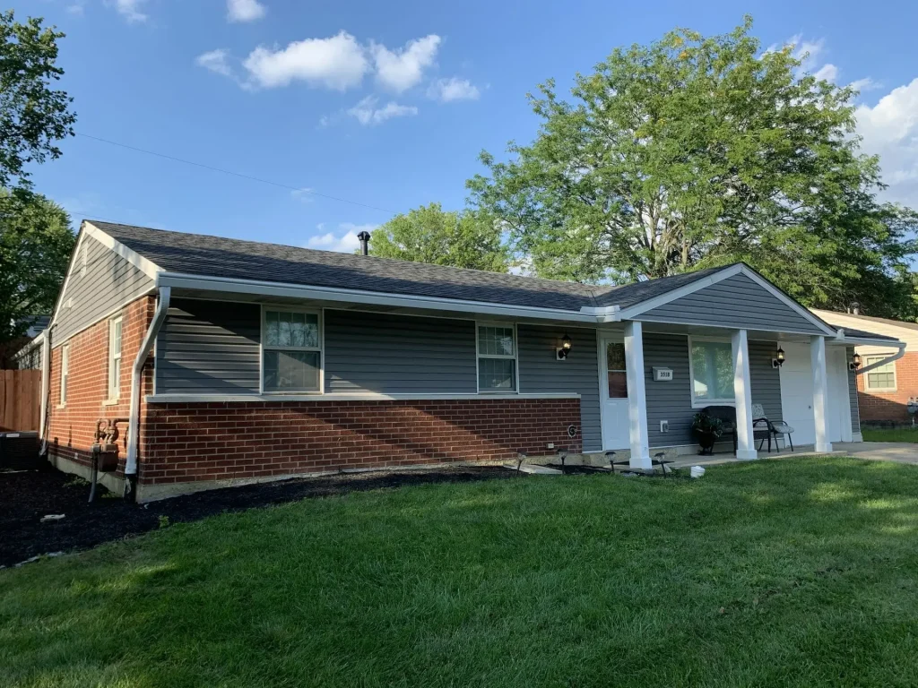 Blue ranch home with K-Guard gutters