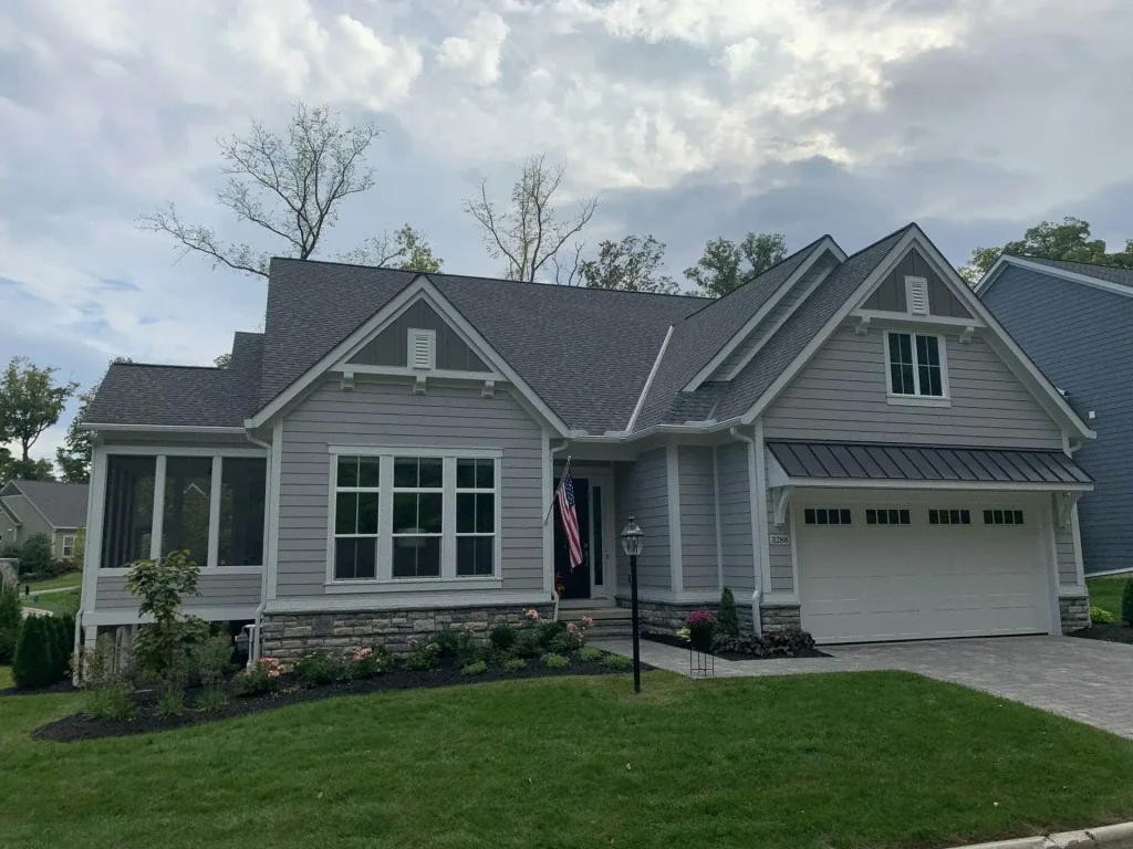 Gray home with K-Guard gutters and a front porch