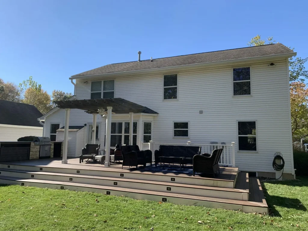 White two-story home with K-Guard gutters