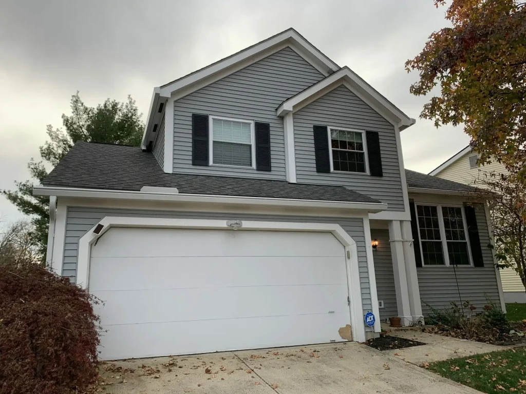 Gray home and garage with K-Guard gutters